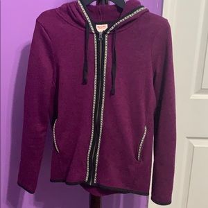 Purple zip-up jacket.